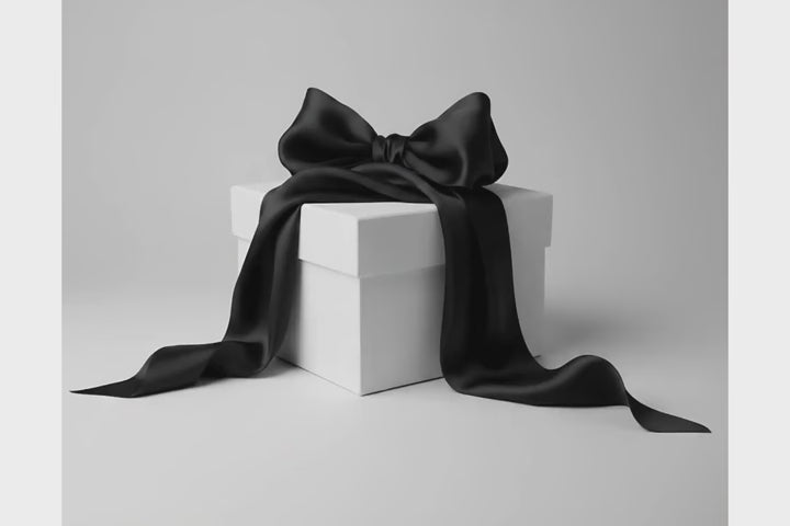 boite cadeau blanche gros noeud noir qui s'ouvre avec des paillettes argentés Majma Boutique